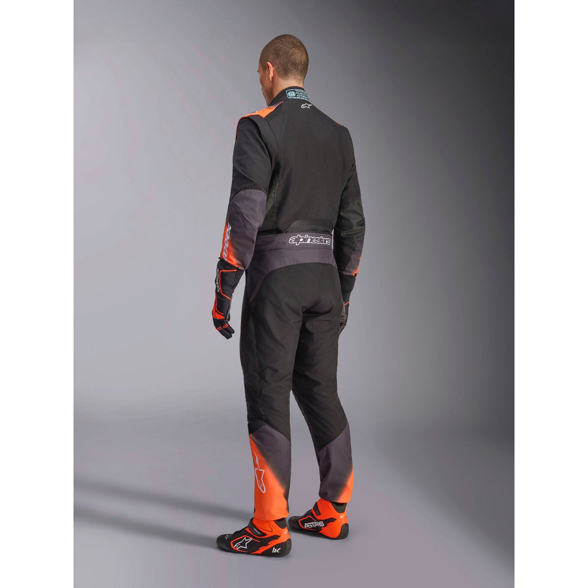 Traje de Karting Alpinestars KMX-5 V3 FIA 8877-2022 Negro/Blanco/Naranja Flúo, vista lateral trasera