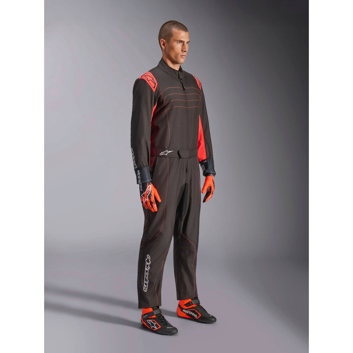 Traje de Karting Alpinestars KMX-9 V3 FIA 8877-2022 Negro/Rojo Flúo, vista lateral delantera